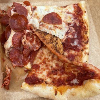 Zamboni's Pizza - Two hot slices piled on each other and toppings falling off. What a mess. - Pizza Near Me - Orinda, California Zamboni's Pizza - Two hot slices piled on each other and toppings falling off. What a mess. - Pizza Near Me - Orinda, California