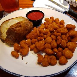 Popcorn shrimp, baked potato. Popcorn shrimp, baked potato.