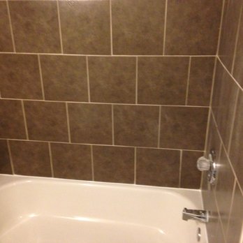 LaFleur’s Renovations - New tub, taps and new tile on walls - General Contractors Near Me