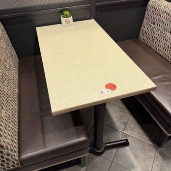 Chick-fil-A - This is table 8, the table immediately in front of the counter that was filthy - Fast Food Near Me - Covington, Georgia
