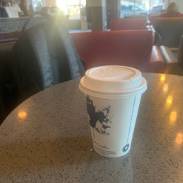 a cup of coffee on a table