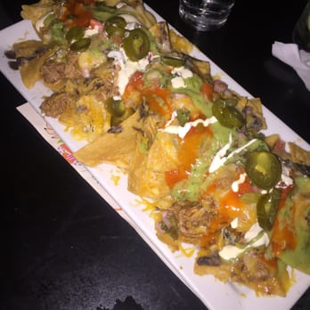 Roxanne's - Giant plate of nacho deliciousness. - Lounges Near Me - Long Beach, California