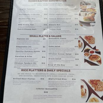Scratch Kitchen - Menu page 1 - The menu page from Scratch Kitchen includes sections for handcrafted sandwiches, small plates & salads, and rice platters & daily specials. It lists dishes such as the Angie's Lobster, Housemade Crabcake, Reuben, BBQ Sirloin Tips, and Ham & Cheese Melt, with prices ranging from $13 to $28. The small plates include empanadas, quesadilla fiesta, Cobb salad, chicken Caesar salad, Greek salad, and soup of the day. Rice platters feature grilled meat and lobster quesadilla, with prices from $8 to $28. The menu emphasizes locally sourced, fresh ingredients and includes detailed descriptions of each dish. - Breakfast & Brunch Near Me - Olney, Maryland