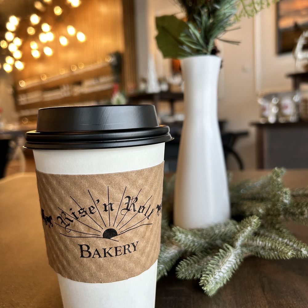 Rise’n Roll Bakery - a cup of coffee on a table - Bakeries Near Me - Avon, Indiana Rise’n Roll Bakery - a cup of coffee on a table - Bakeries Near Me - Avon, Indiana