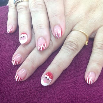 Tip N Toe Salon - My mom got gel acrylic with candy cane tips and a Santa also by BeBe - Nail Salons Near Me - Hollister, California