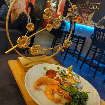 Deluxe Fun Dining - Entree of blackened salmon, whole shrimp, and edible gold foil. - Bars Near Me - Charlotte, North Carolina Deluxe Fun Dining - Entree of blackened salmon, whole shrimp, and edible gold foil. - Bars Near Me - Charlotte, North Carolina