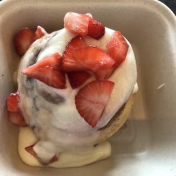custom cinnamon roll with chai icing & strawberries