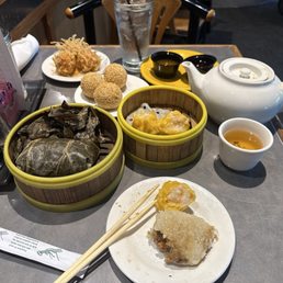 Sticky rice, shrimp shumai, shrimp balls, red bean filled sesame balls, and Jasmine tea. All delicious!