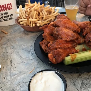 Duff's Famous Wings - 20 pieces buffalo wings w/ celery, carrots, blue cheese and large fries. Blue cheese ans fries were delicious. - Chicken Wings Near Me - Depew, New York