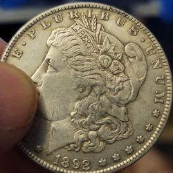 Coins & Valuables - I would like to see if you guys can help me with this coin and tell me how much is it worth It's a $1! Thank you in advance