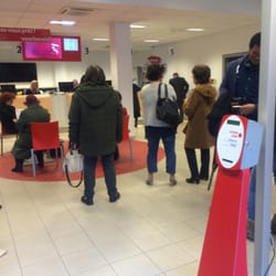 bpost - See ticket number on screen, but grab ticket from the big red stand in right foreground