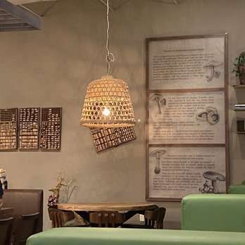 The Naked Olive - a dining area with green couches - Mediterranean Near Me - Kennett Square, Pennsylvania The Naked Olive - a dining area with green couches - Mediterranean Near Me - Kennett Square, Pennsylvania
