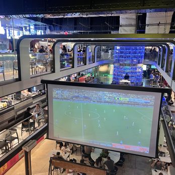 Julia & Henry's - Massive projection TV - Food Court Near Me - Miami, Florida