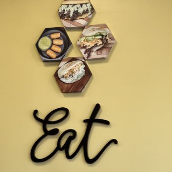 Ceci’s Arepa Joint - a sign that says eat - Venezuelan Near Me - East Meadow, New York