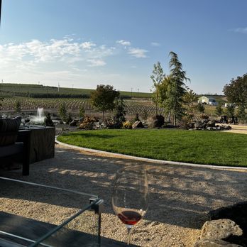 Whitman Hill Winery - a glass of wine in the foreground - Wineries Near Me - Zillah, Washington Whitman Hill Winery - a glass of wine in the foreground - Wineries Near Me - Zillah, Washington