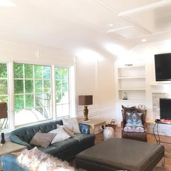 United Construction & Restoration - a living room with a fireplace - General Contractors Near Me - Edmond, Oklahoma United Construction & Restoration - a living room with a fireplace - General Contractors Near Me - Edmond, Oklahoma