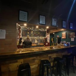 a bar with stools a bar with stools