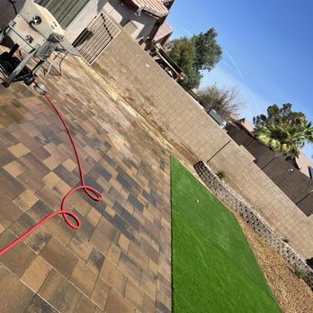 JFC LANDSCAPE - a lawn being cleaned with a hose - Landscaping Near Me - Las Vegas, Nevada