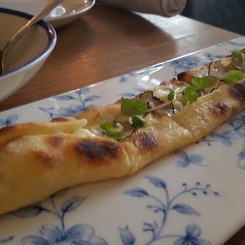 Byblos - Wood Fired Pita Bread (Black Truffle and Buffalo Mozarella) - Mediterranean Near Me - Toronto, Ontario Byblos - Wood Fired Pita Bread (Black Truffle and Buffalo Mozarella) - Mediterranean Near Me - Toronto, Ontario