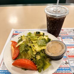 Riverside Pizzeria - House dressing and side salad, very fresh and tasty.