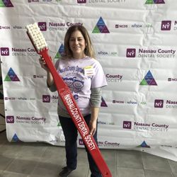 Lisa Sedotto, DMD - Give Kids a Smile volunteer at the. Randle of Aviation Museum.