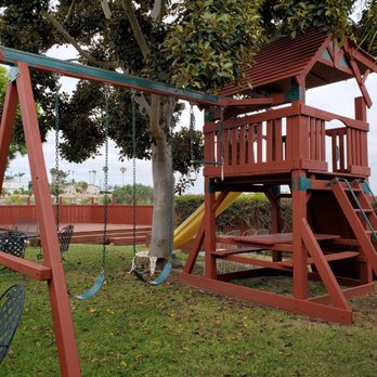 Deck Doctor - Full view of large play structure newly stained - Pressure Washers Near Me