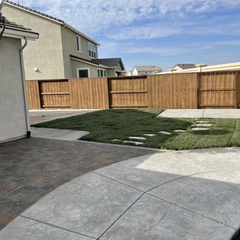 Bella View Landscape - This is the grass and concrete work they did in our backyard. Did a great job tying our existing work in with what we requested. - Landscaping Near Me