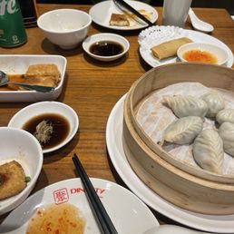 Steamed veggie and egg dumplings. Spring rolls. Fried tofu pudding. Steamed veggie and egg dumplings. Spring rolls. Fried tofu pudding.