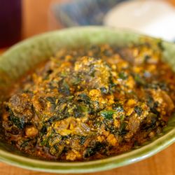 Golden Safari - Egusi - African Melon Seed & Vegetable Soup w/ Goat Meat ($18.99 + $3/Goat) also comes w/ FuFu pictured in background