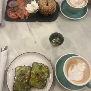 Slate Cafe - Nomad - Avocado toast on gluten free bread & smoked salmon bagel with a cappuccino and latte. Perfection. - Coffee & Tea Near Me - New York, New York