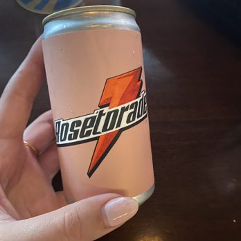 Due West - a person holding a can of soda - Cocktail Bars Near Me - New York, New York Due West - a person holding a can of soda - Cocktail Bars Near Me - New York, New York