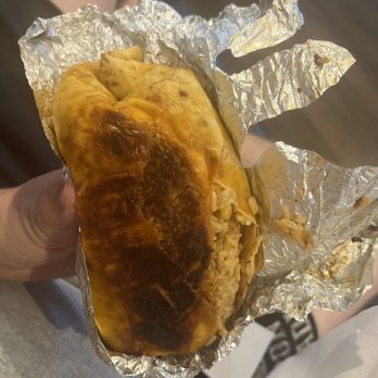 Savage Burrito - a hand holding a burrito - Tex-Mex Near Me - Ashburn, Virginia Savage Burrito - a hand holding a burrito - Tex-Mex Near Me - Ashburn, Virginia