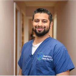 Davinder Bhela, DPM - Dr. Davinder Bhela in scrubs