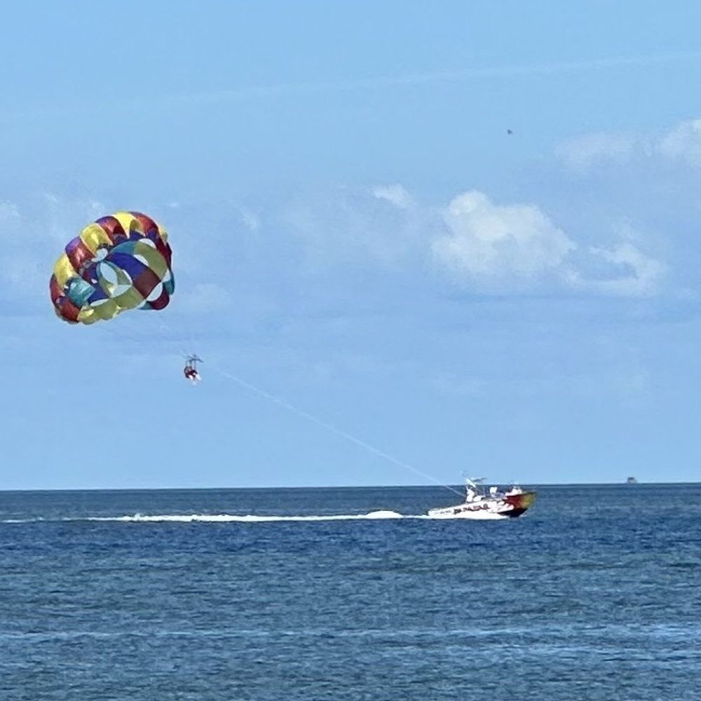 Cedar Island Ferry - A view from the ferry of someone parasailing in the Sound. - Ferries Near Me - Cedar Island, North Carolina