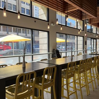 Modern Market Eatery - Yellow bar stools and vibrancy! - Breakfast & Brunch Near Me - Denver, Colorado