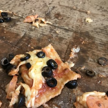 Maple Bakery - a half eaten pizza with olives and cheese - Bakeries Near Me - Vaughan, Ontario