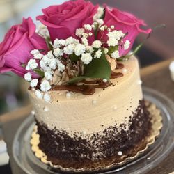 Chocolate caramel mini cake for my sister-in-law... I added the flowers and pearl sprinkles..
