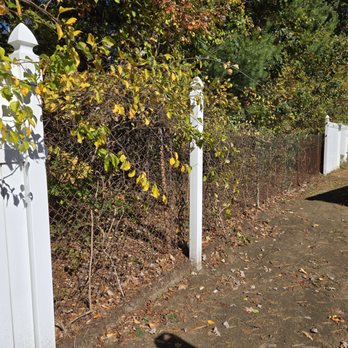 Whitman Restoration - Removal of vinyl fencing . . . chain link behind it, so no reason for removal. - General Contractors Near Me