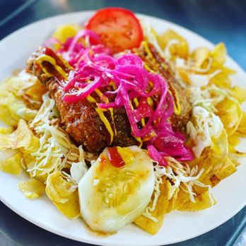Jays Eats - Fried quarter Leg of Chicken, served on a bed of plantain chips, shredded cabbage, pickled onions, tomato, ketchup, mustard and broth. - Food Trucks Near Me - Woodbridge, Virginia Jays Eats - Fried quarter Leg of Chicken, served on a bed of plantain chips, shredded cabbage, pickled onions, tomato, ketchup, mustard and broth. - Food Trucks Near Me - Woodbridge, Virginia
