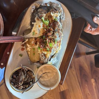 Sonora Steak - This is the baked potato! We shared it between the 4 of us! - Steakhouses Near Me - Maple Valley, Washington