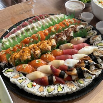 Tomo Sushi & Sashimi - 100 pc sushi, sashimi and rolls tray minus 2 pieces bc someone started eating it before my picture - Sushi Bars Near Me - Upper Darby, Pennsylvania
