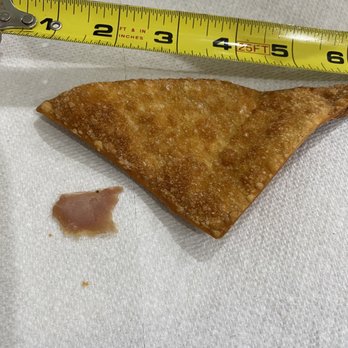 Golden Palace - a piece of pizza and a measuring tape - Chinese Near Me - Omaha, Nebraska