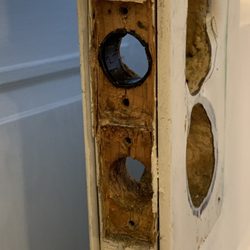 Smith & Bishel - The top through-hole was the one I used. It had a black spacer installed, which ultimately had to be removed.