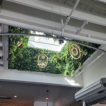 Binary Brewing - Some neon tech decor amongst some greenery! - Beer Bar Near Me - Beaverton, Oregon