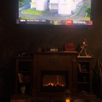 Rebel & Rose - Fireplace with large tv - Sports Bars Near Me - Dallas, Texas Rebel & Rose - Fireplace with large tv - Sports Bars Near Me - Dallas, Texas