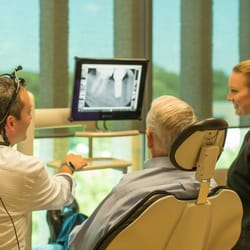 38th Street Dental - Dr. Meek and his assistant Melissa discussing dental implant treatment