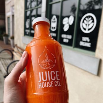 Juice House - Benicia - a hand holding a bottle of juice - Coffee & Tea Near Me - Benicia, California