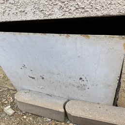 This is the door to under my house that after Orkin came. Broken and with BIG GAPs!!!! WTF?