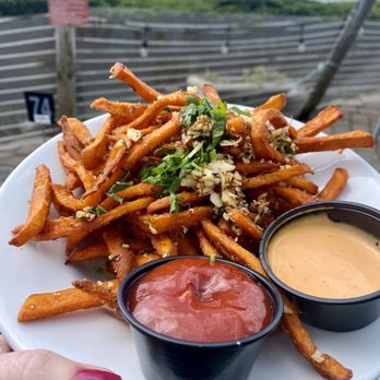 Moss Beach Distillery - Sweet potato garlic fries with honey mustard dipping sauce & smoky ketchup - perfect with a beer! - Seafood Near Me - Moss Beach, California Moss Beach Distillery - Sweet potato garlic fries with honey mustard dipping sauce & smoky ketchup - perfect with a beer! - Seafood Near Me - Moss Beach, California