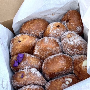 Leonard's Bakery - Dozen malasadas (original, macadamia, dobash, ube) - Bakeries Near Me - Honolulu, Hawaii Leonard's Bakery - Dozen malasadas (original, macadamia, dobash, ube) - Bakeries Near Me - Honolulu, Hawaii